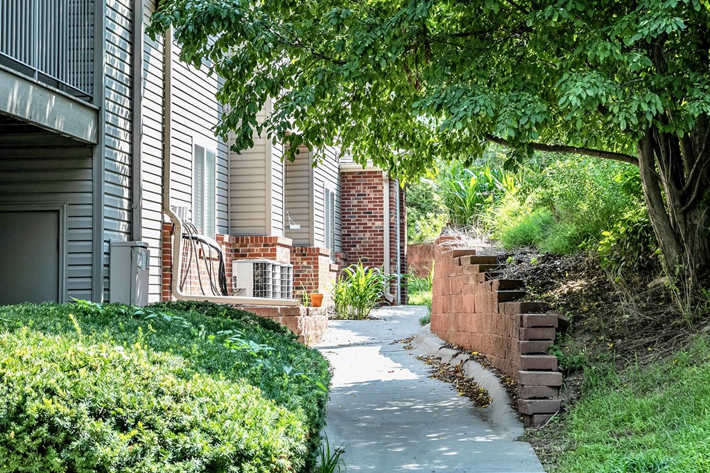 Exterior Beautiful walkway with plants at Deer Park Apartments in Council Bluffs, IA