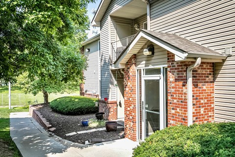 Cozy Exterior with Plants and greenery  at Deer Park Apartments in Council Bluffs, IA