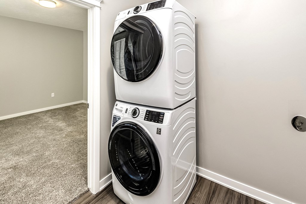 an image of a washing machine and dryer in a laundry room