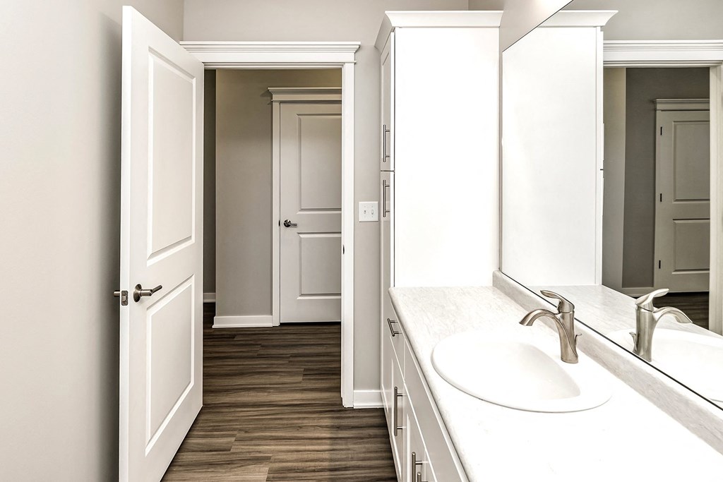 a view of a bathroom with a sink and a mirror