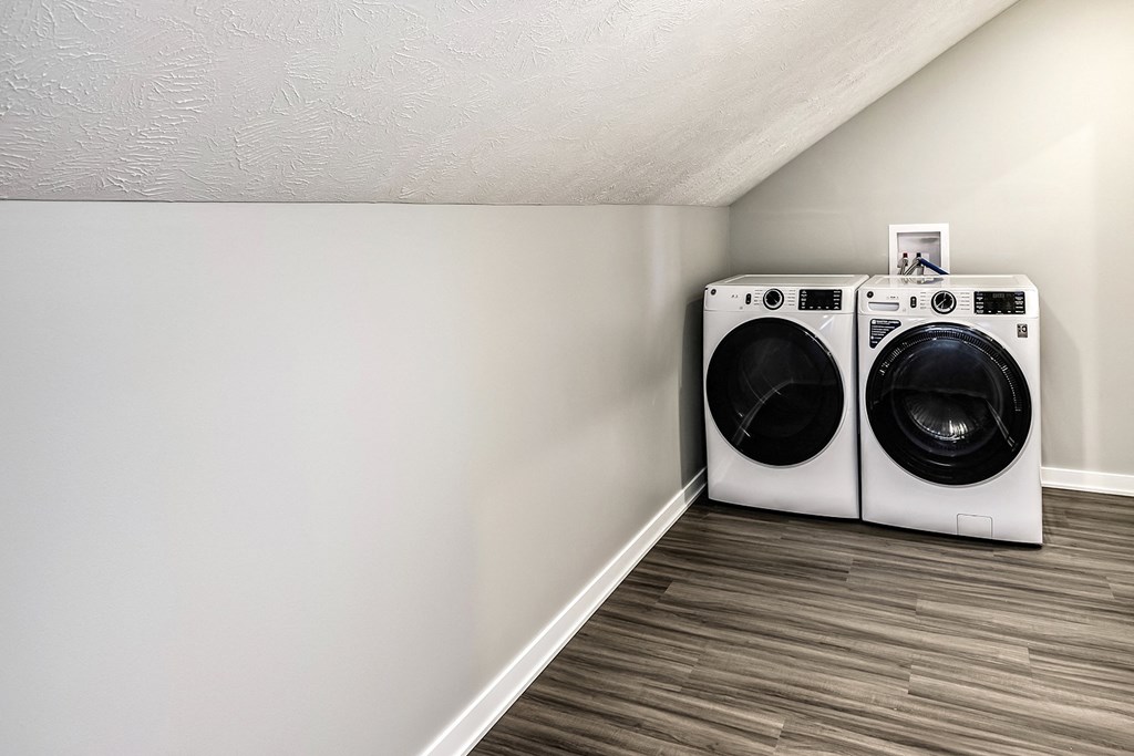 a laundry room with two washing machines in it