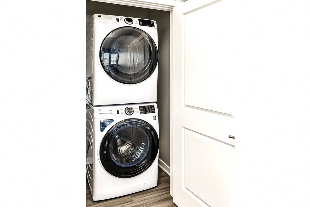 a front loading washer and dryer in a laundry room