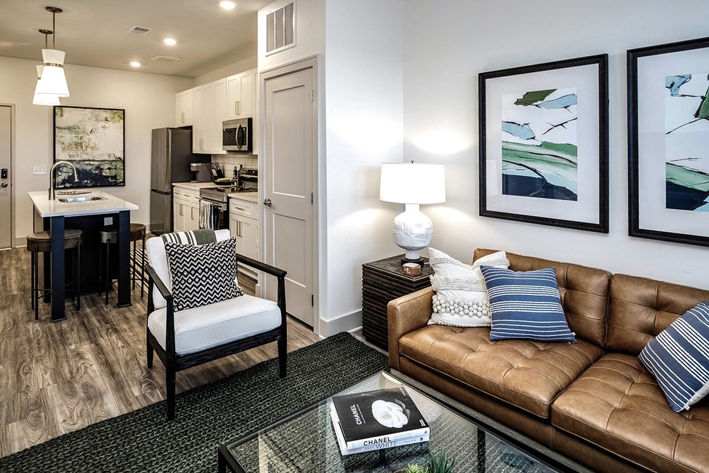 Studio, one, and two-bedroom apartment homes with stainless steel appliances, quarts countertops, designer cabinetry, large kitchens, luxury vinyl plank flooring, high vaulted ceilings, high-end lighting, in-unit washer and dryer, and energy efficient windows at Fireside at Waukee in Waukee, IA