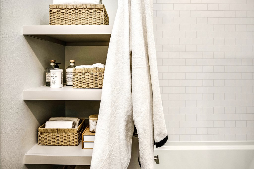 Studio, one, and two-bedroom apartment homes with stainless steel appliances, quarts countertops, designer cabinetry, large kitchens, luxury vinyl plank flooring, high vaulted ceilings, high-end lighting, in-unit washer and dryer, and energy efficient windows at Fireside at Waukee in Waukee, IA