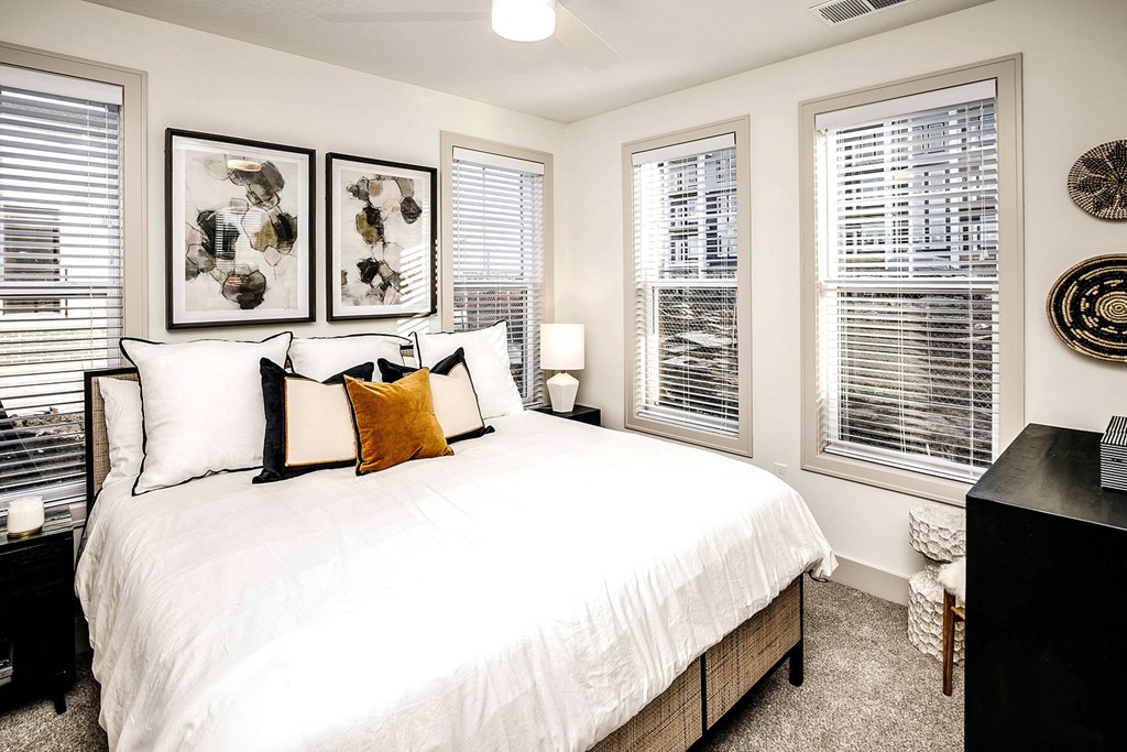 Studio, one, and two-bedroom apartment homes with stainless steel appliances, quarts countertops, designer cabinetry, large kitchens, luxury vinyl plank flooring, high vaulted ceilings, high-end lighting, in-unit washer and dryer, and energy efficient windows at Fireside at Waukee in Waukee, IA