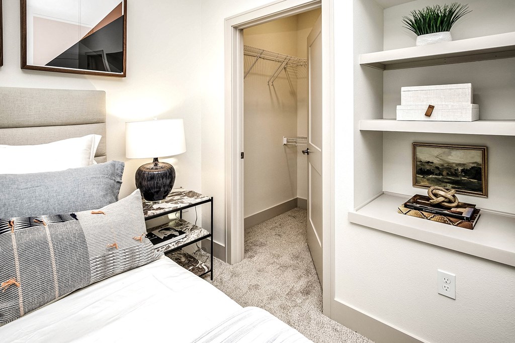 Studio, one, and two-bedroom apartment homes with stainless steel appliances, quarts countertops, designer cabinetry, large kitchens, luxury vinyl plank flooring, high vaulted ceilings, high-end lighting, in-unit washer and dryer, and energy efficient windows at Fireside at Waukee in Waukee, IA