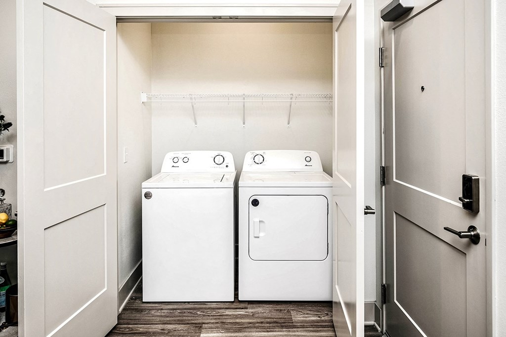 Studio, one, and two-bedroom apartment homes with stainless steel appliances, quarts countertops, designer cabinetry, large kitchens, luxury vinyl plank flooring, high vaulted ceilings, high-end lighting, in-unit washer and dryer, and energy efficient windows at Fireside at Waukee in Waukee, IA