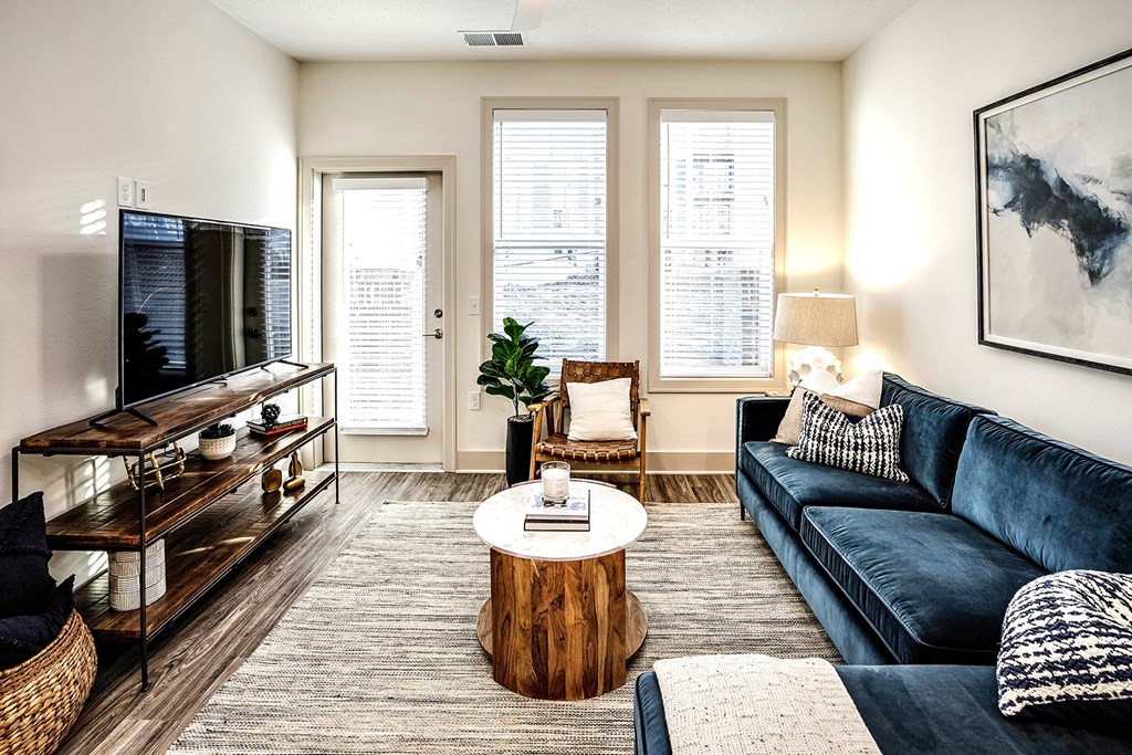 Studio, one, and two-bedroom apartment homes with stainless steel appliances, quarts countertops, designer cabinetry, large kitchens, luxury vinyl plank flooring, high vaulted ceilings, high-end lighting, in-unit washer and dryer, and energy efficient windows at Fireside at Waukee in Waukee, IA