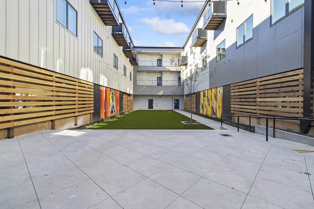 Private Outdoor Courtyard with Yard Games, Grills and Fire Pit at G at Market in Bentonville, AR