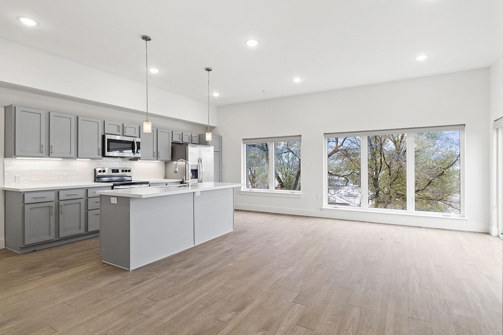 Large open kitchens with custom quartz countertops at G at Market in Bentonville, AR