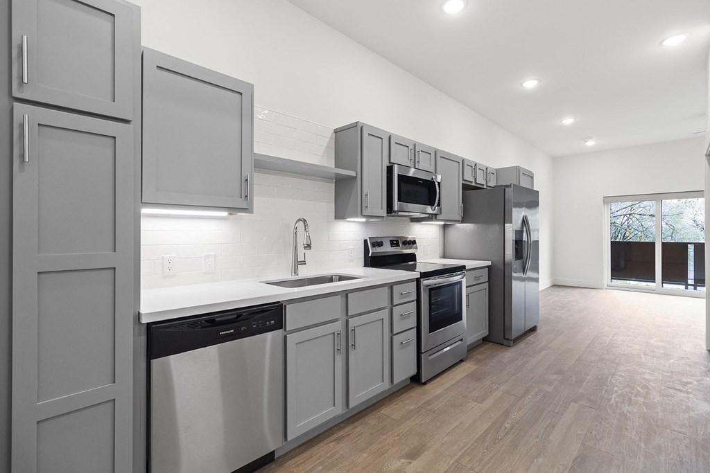 Large open kitchens with custom quartz countertops at G at Market in Bentonville, AR