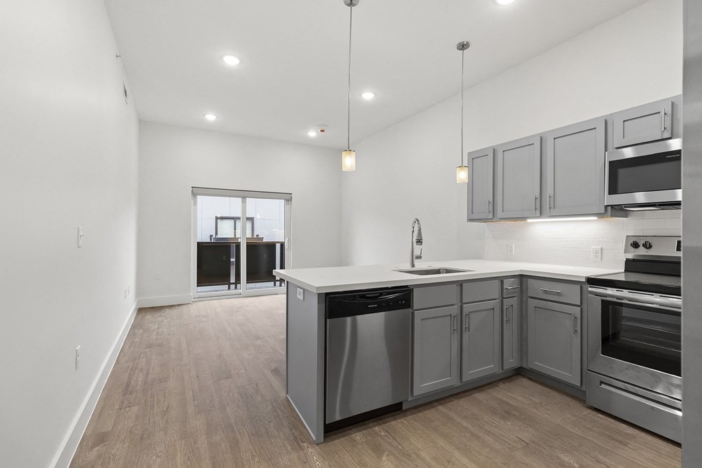 Large open kitchens with custom quartz countertops at G at Market in Bentonville, AR