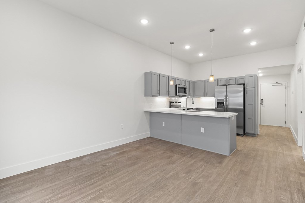 Large open kitchens with custom quartz countertops at G at Market in Bentonville, AR