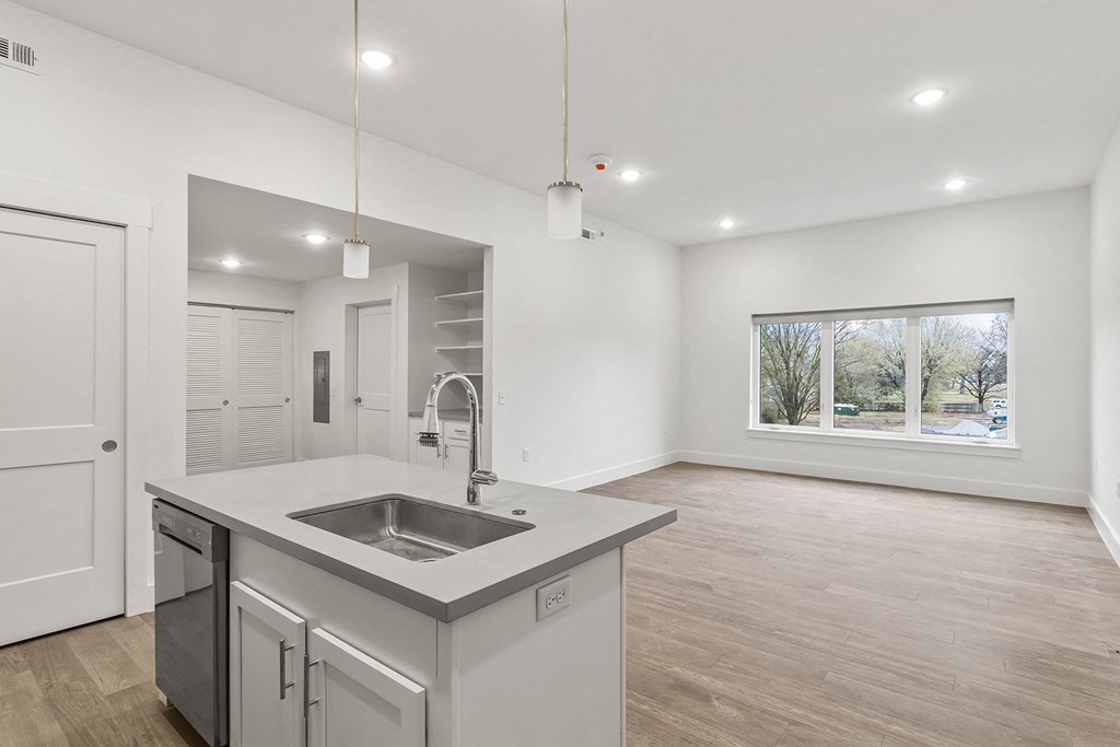 Large open kitchens with custom quartz countertops at G at Market in Bentonville, AR