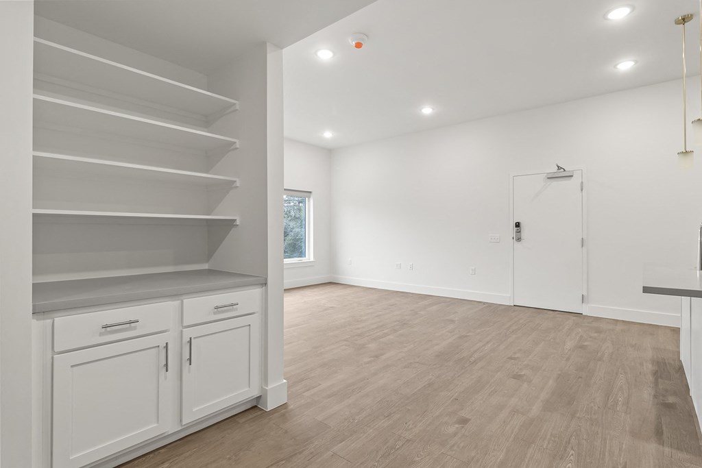 Large living spaces with built-in cabinets at G at Market in Bentonville, AR