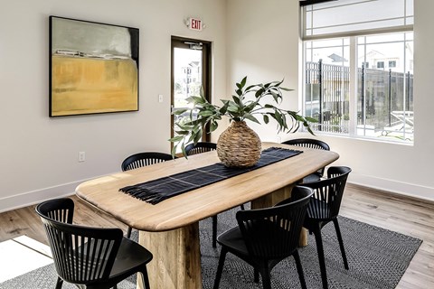 Clubhouse dining area with large window at Hanover Flats in Bennington, NE