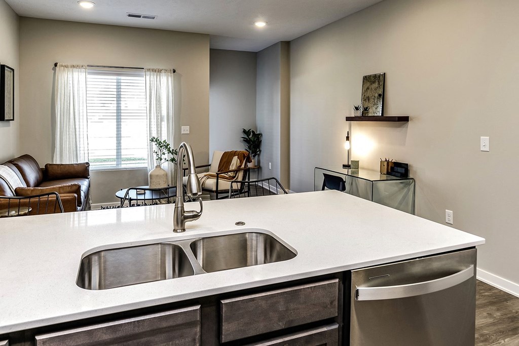 Kitchen with large sink and dishwasher at Hanover Flats in Bennington, NE