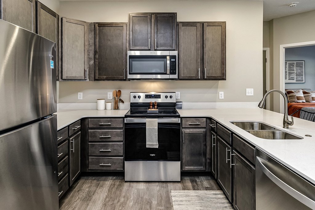 Kitchen with stainless steel appliances at Hanover Flats in Bennington, NE