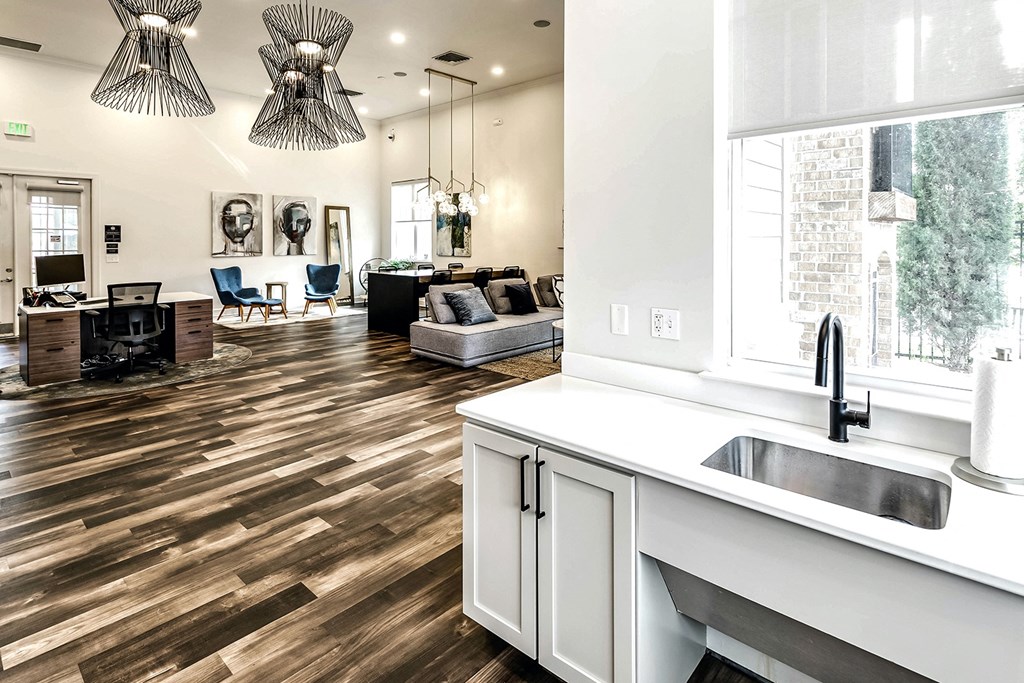 Spacious clubhouse with wood plank flooring at Legacy Commons Apartments in Omaha, NE