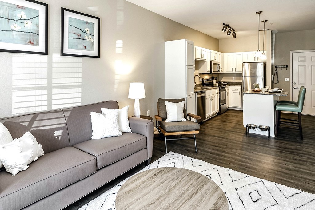 Beautiful Living Room with wood plank flooring at Legacy Commons Apartments in Omaha, NE