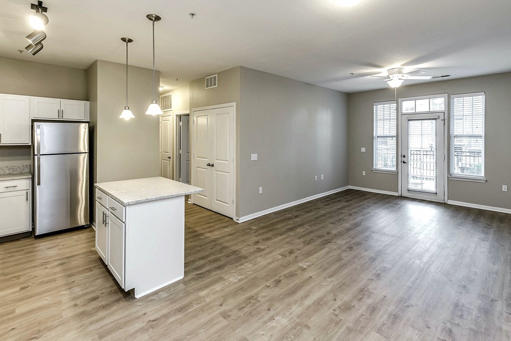 Large Living Room with sophisticated light fixtures  at Legacy Commons, Omaha, Nebraska