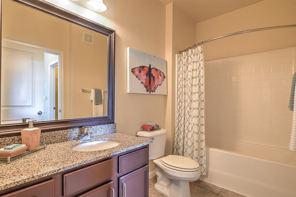 a bathroom with a toilet sink and bathtub
