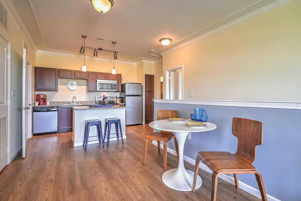a kitchen and dining area in a 555 waverly unit