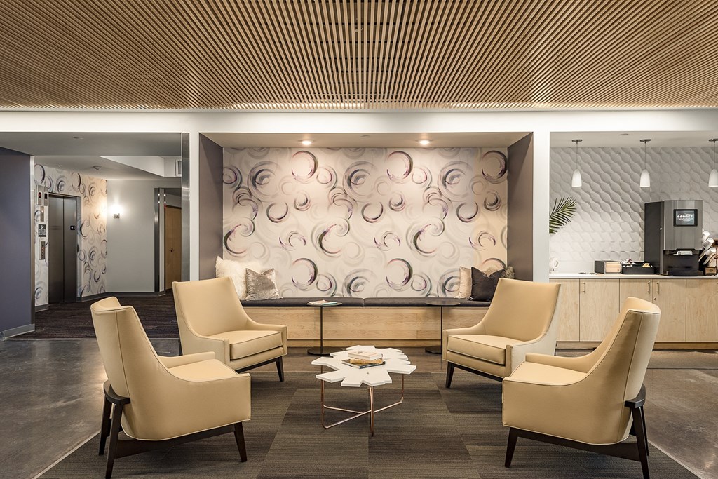 The Reverie Lounge with Fireplace and Complimentary Coffee Bar at The Nexus at Gray's Landing in Downtown Des Moines, IA