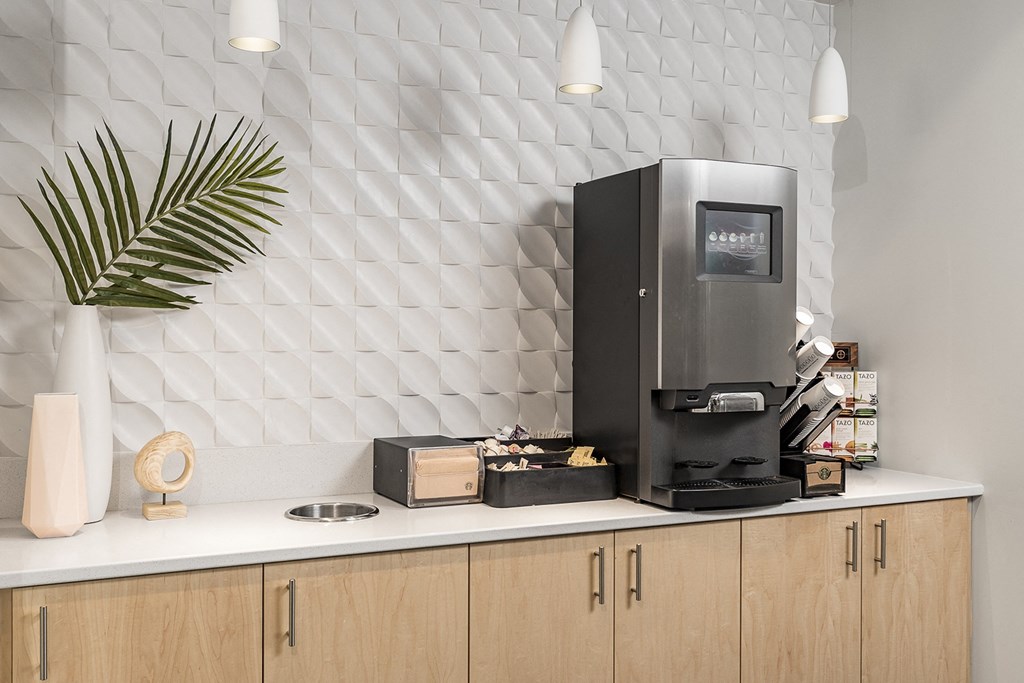 The Reverie Lounge with Fireplace and Complimentary Coffee Bar at The Nexus at Gray's Landing in Downtown Des Moines, IA