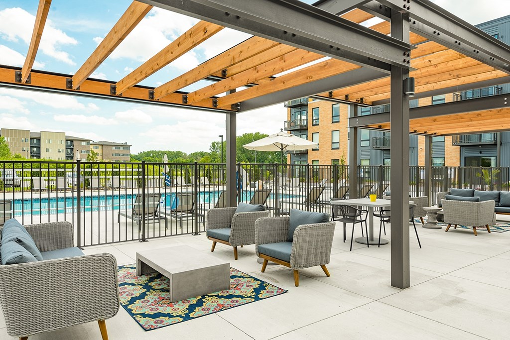 The Sanctuary Deck featuring a resort-style pool, firepit, summer kitchen with outdoor grills, hammocks and bocce ball court at The Nexus at Gray's Landing in Downtown Des Moines, IA