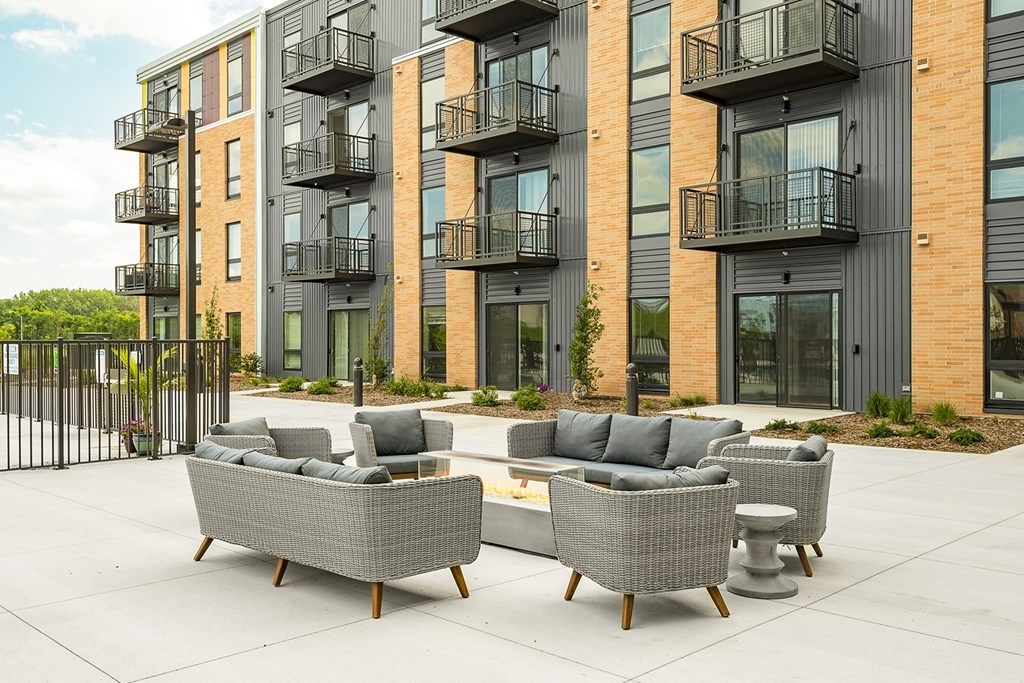 The Sanctuary Deck featuring a resort-style pool, firepit, summer kitchen with outdoor grills, hammocks and bocce ball court at The Nexus at Gray's Landing in Downtown Des Moines, IA