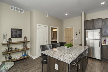 Granite Kitchen Island at The Nexus at Gray's Landing in Downtown Des Moines, NE