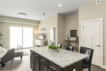 Granite Kitchen Island at The Nexus at Gray's Landing in Downtown Des Moines, NE