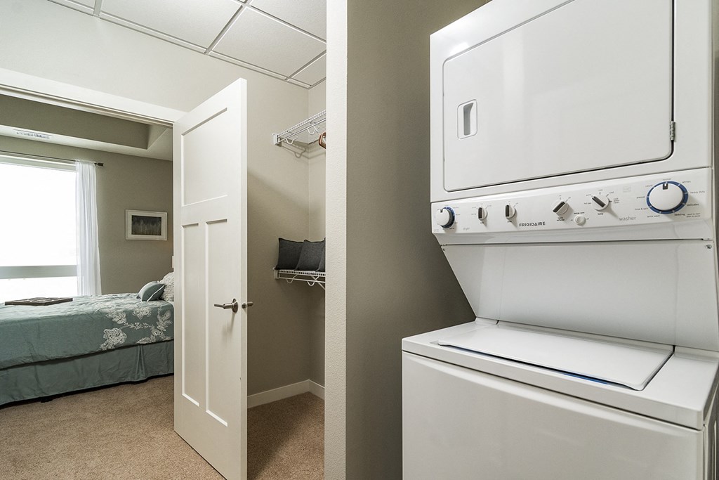 One and two bedroom hi-end apartment homes featuring Energy-Efficient Stainless Steel Appliances,  Granite Kitchen Island, dark cabinets, and much more at The Nexus at Gray's Landing in Downtown Des Moines, IA
