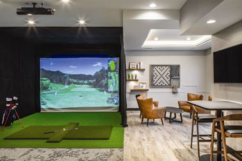 Game room with golf simulator at Park125 in Omaha, NE