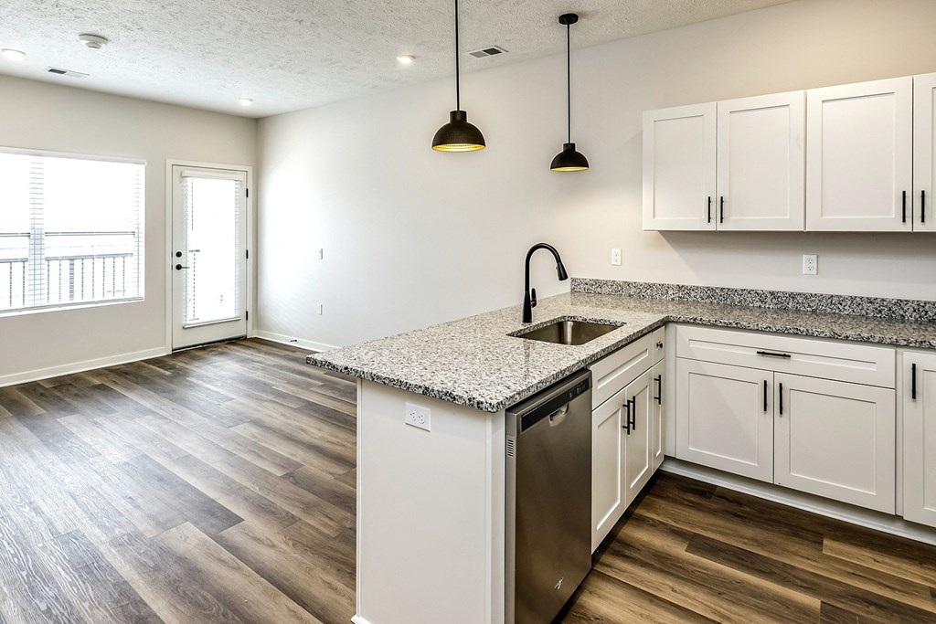 Studio, one and two bedroom apartment homes featuring stainless steel appliances, luxury vinyl floor, granite countertops, large closets and full-size washer and dryer at The Parker in Papillion, NE