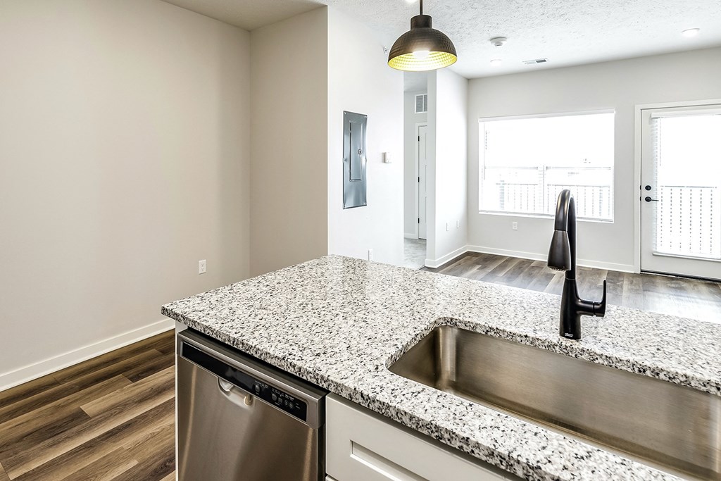 Studio, one and two bedroom apartment homes featuring stainless steel appliances, luxury vinyl floor, granite countertops, large closets and full-size washer and dryer at The Parker in Papillion, NE