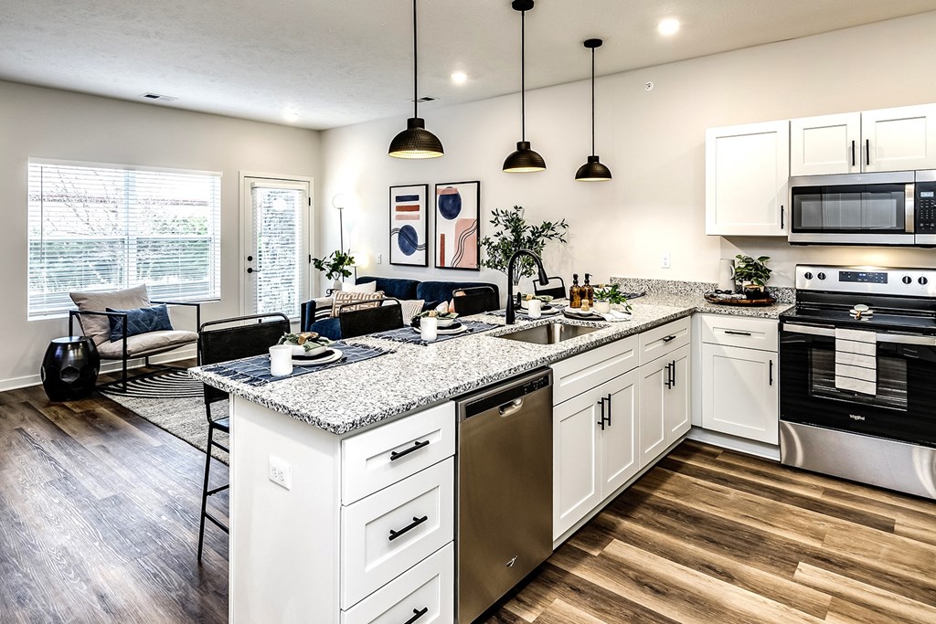 Studio, one and two bedroom apartment homes featuring stainless steel appliances, luxury vinyl floor, granite countertops, large closets and full-size washer and dryer at The Parker in Papillion, NE