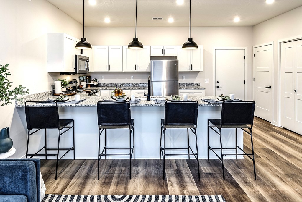 Studio, one and two bedroom apartment homes featuring stainless steel appliances, luxury vinyl floor, granite countertops, large closets and full-size washer and dryer at The Parker in Papillion, NE