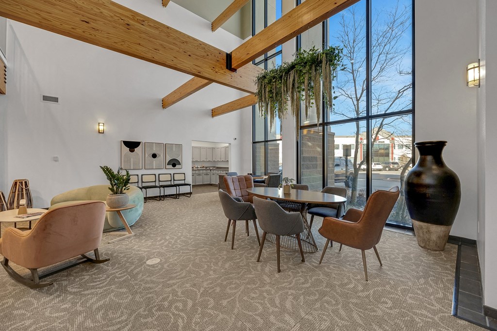 Modern clubhouse featuring community lounge, coffee bar, salon and spa, billiards and poker room, and concierge package room at Parkside Apartments and Shops in Bentonville, AR