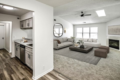 an open living room and kitchen with a couch and a table