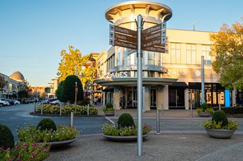 Located by nearby shops and dining at The Grove in Rogers, AR