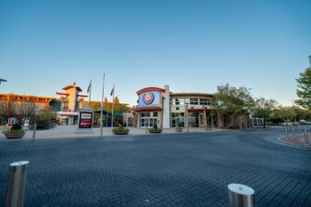 Located by nearby shops and dining at The Grove in Rogers, AR