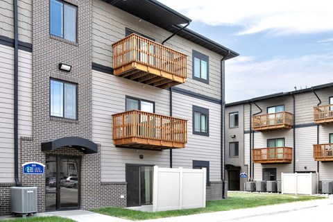Property Exterior with Patio and Balconies at Residences at Oak Pointe in Grand Island, NE