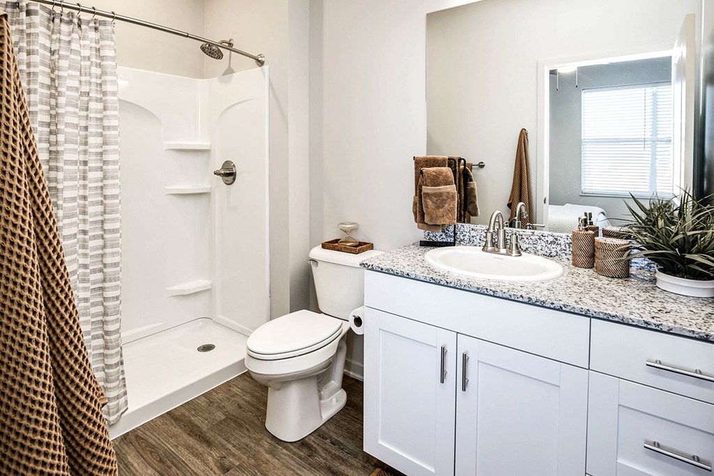 Two and three bedroom townhomes featuring golf course views, fill-size washer and dryer, stainless steel appliances, granite countertops, kitchen island, faux wood flooring and smart-home technology with keyless entry at Sandstone Villas in Omaha, NE