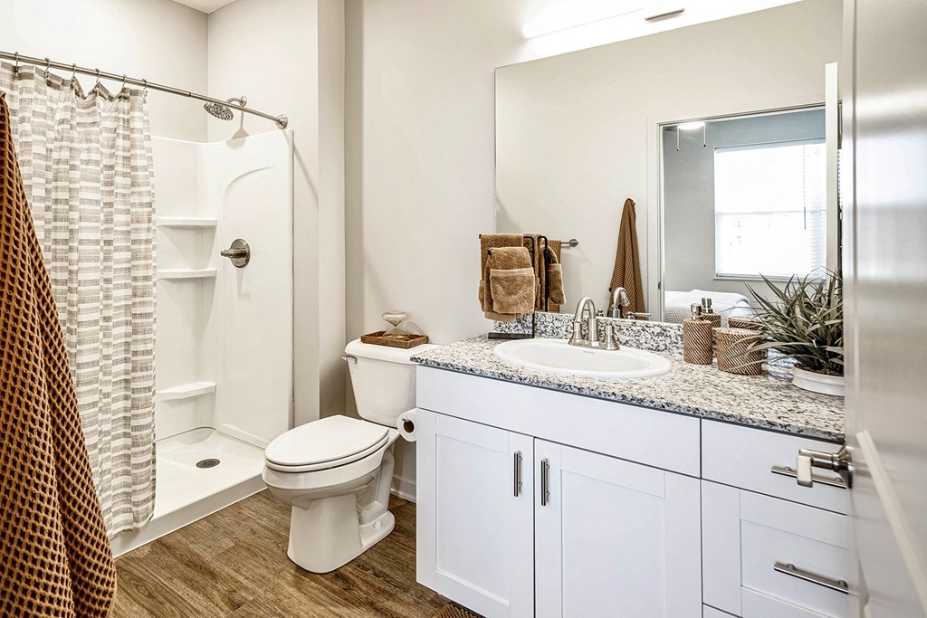 Two and three bedroom townhomes featuring golf course views, fill-size washer and dryer, stainless steel appliances, granite countertops, kitchen island, faux wood flooring and smart-home technology with keyless entry at Sandstone Villas in Omaha, NE