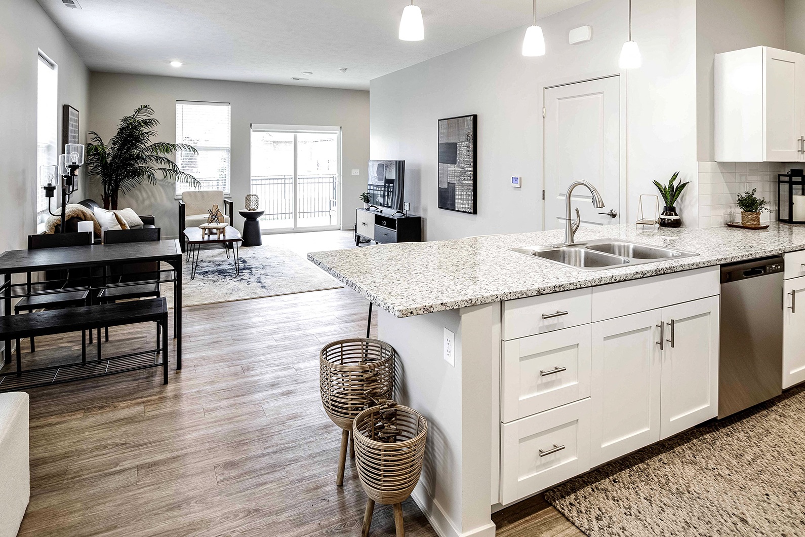 Two and three bedroom townhomes featuring golf course views, fill-size washer and dryer, stainless steel appliances, granite countertops, kitchen island, faux wood flooring and smart-home technology with keyless entry at Sandstone Villas in Omaha, NE