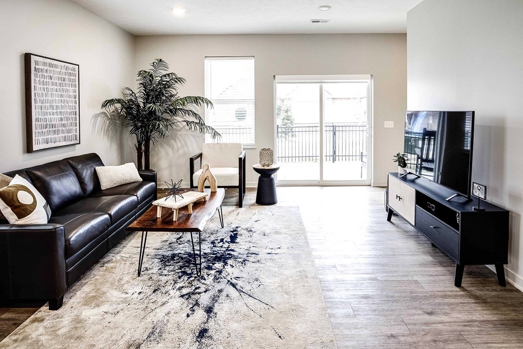 Two and three bedroom townhomes featuring golf course views, fill-size washer and dryer, stainless steel appliances, granite countertops, kitchen island, faux wood flooring and smart-home technology with keyless entry at Sandstone Villas in Omaha, NE