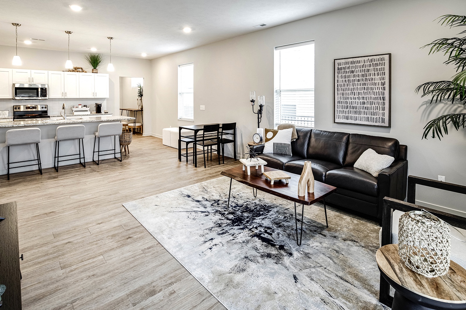 a living room with a couch and a table at Sandstone Villas Apartments, Nebraska, 68116
