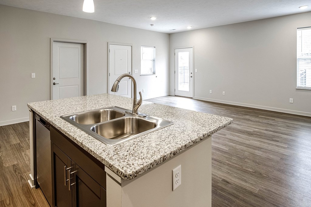 Two and three bedroom townhomes featuring golf course views, fill-size washer and dryer, stainless steel appliances, granite countertops, kitchen island, faux wood flooring and smart-home technology with keyless entry at Sandstone Villas in Omaha, NE